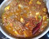 A picture of step 4 of Karahi qeema matar with brown onion rice.