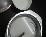 A picture of step 10 of Hibiscus Thai rice balls dunk in coconut milk.