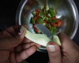 A picture of step 2 of Mix Spicy-Tangy Pickle.