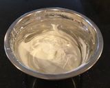 A picture of step 5 of Vanilla Layer Cake filled withLenon and Rasberry and frosted with Fresh Lemon Cream.
