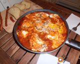 Φωτογραφία βήματος 18 της συνταγής Shakshuka. Αυγά σε σάλτσα ντομάτας