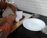 A picture of step 9 of Biscuits Meethi (Swiss roll style).