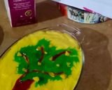A picture of step 11 of Mango custard cake with green mango tree.
