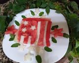 A picture of step 2 of Red yellow melon dessert in the shape of a flag.