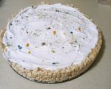 A picture of step 4 of Frootloop Protein Rice Krispy Treat Cheesecake.
