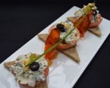 Foto del paso 4 de la receta Tostas de tomate confitado y pollo