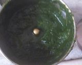A picture of step 2 of Palak panch dal khichdi tempered with burnt garlic.