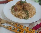 A picture of step 7 of Orange Chicken with fried rice.