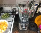 A picture of step 1 of Orange, Kiwi, and Unsweetened Almond Milk Smoothie.