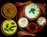 A picture of step 22 of Tamilnadu Thali - rice, sambar, mor kuzhambu, beetroot poriyal, payasam, buttermilk for lunch.