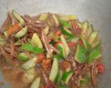 Foto langkah ke 3 dari resep 262. Tumis Timun Teri Kemangi.