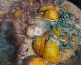 A picture of step 4 of Chicken Aloo in white gravy.