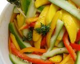 A picture of step 2 of Mango Bell peppers Cucumber Salad with Thyme Vinaigrette.
