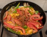 A picture of step 8 of Paneer Jalfrezi with steamed white rice.