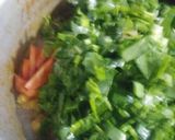A picture of step 5 of Palak chicken with boiled rice.
