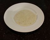 A picture of step 16 of Crab and Shrimp Enchiladas with Hatch Chili Sauce.