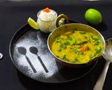 A picture of step 7 of Lasooni Dal Palak with Gondhoraj lebu/ lemon.