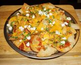 A picture of step 4 of NACHOS WITH GOAT CHEESE, AVOCADO, AND SOUR CREAM.