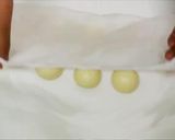 A picture of step 12 of Wagashi "Komugi-Manju" with a Fresh Herb.