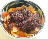 A picture of step 3 of Black rice porridge with fruits and nuts.