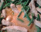 A picture of step 14 of Green Beans and Marinated Pork Strips.