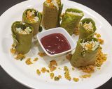 A picture of step 8 of Chilli paneer stuffed spinach wrap.