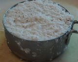 A picture of step 4 of Sweet Puttu (steamed rice cake from Kerala) with coconut.
