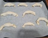 Foto del passaggio 3 della ricetta Cornetti salati di sfoglia con cotto e formaggio