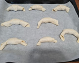 Foto del passaggio 3 della ricetta Cornetti salati di sfoglia con cotto e formaggio