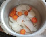 A picture of step 1 of Mooli Gajar Shalgam Kadhi.