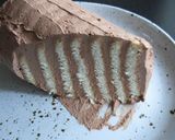 A picture of step 5 of Marie Biscuits Log Cake.