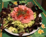 Une image de l'étape 9 de Salade de feuille de chêne aux tomates, courgettes et mortadelle de Bologne.