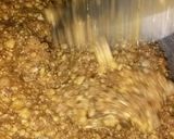 A picture of step 3 of Besan with dry fruits.