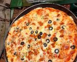 A picture of step 4 of Chicken tikkka pizza.