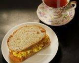 A picture of step 5 of Cheesy Chilli Scrambled Egg sandwich with Darjeeling Tea.