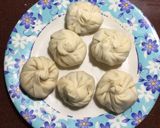 A picture of step 5 of Fish Momo with Fish Balls in Red Sauce.