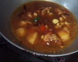 A picture of step 23 of Aloo fulcopi katla rosha ar misti doi.