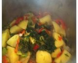 A picture of step 5 of Okra in a terracotta casserole dish.