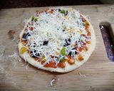 A picture of step 11 of Jain Cheese burst pizza.