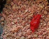 A picture of step 3 of Baked Mince and Spinach Eggs.