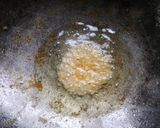 A picture of step 5 of Stuffed rice balls.