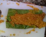 A picture of step 3 of Homemade crispy Patra with some spicy green chutney.
