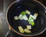 A picture of step 1 of Raw mango rasam.