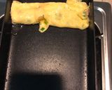 A picture of step 3 of Japanese style egg roll (crab stick with salad dressing).