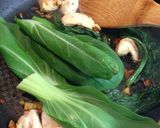 A picture of step 5 of Stir Fried Chicken and Leafy Greens.