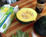 A picture of step 1 of Cumin Rubbed Roasted Acorn Squash with Sage Garlic Butter.