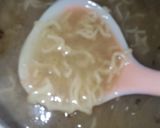 A picture of step 8 of Maggi soup with roasted nuts and chicken 😋😋😋😋.