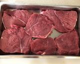 A picture of step 1 of Roast Beef with Red Wine, Garlic and Onions.