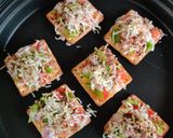 A picture of step 4 of Cream cracker pizza bites.