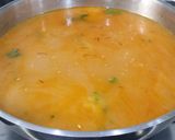 A picture of step 9 of Seafood Paella with Brown Rice.